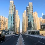 view of Crossing the Dubai Marina Bridge Crossing film location travelers are treated to a breathtaking view of the Marina skyline and the boats in the marina