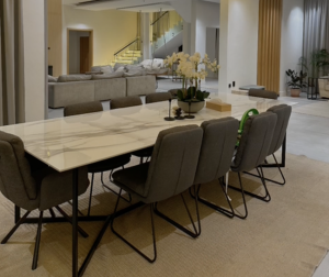 Dining Room Film Location This location captures a serene and meticulously arranged room, dominated by a sense of calm and order. At its heart lies a dining table, an object of both utility and beauty
