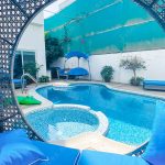 Picture of Dubai Mediterranean Pool Location luxurious poolside setting featuring a pool with crystal clear blue water in a stylish villa.