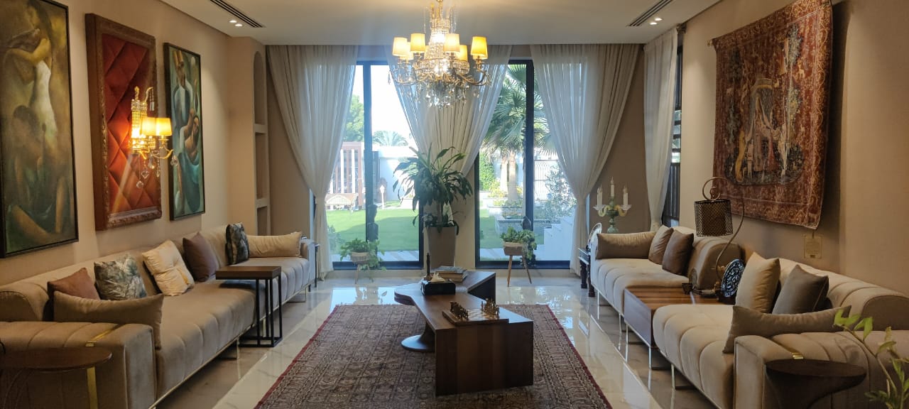 Picture of the Majlis Dubai Lounge Film Location – modern Majlis with sofas, art & chandelier plus cosy family room; ideal for commercials, lifestyle shoots & cinematic projects.
